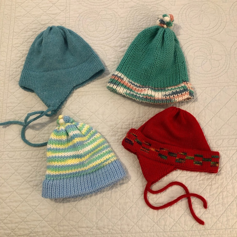 Hand knit hooded baby sweater and hats bundle.